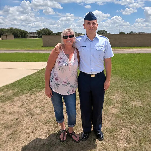 A deceased son added to his mother's photo, back beside her in his Air Force uniform 