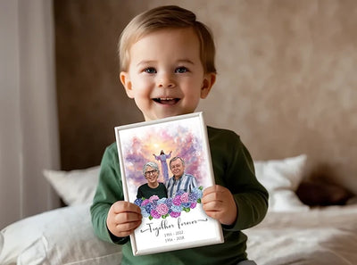 Baby holding a memorial artwork of his grandparents