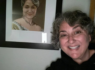 A smiling woman shares a photo review with a custom queen portrait of herself.
