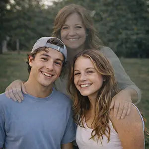 Edited family portrait with a mother added behind her children.