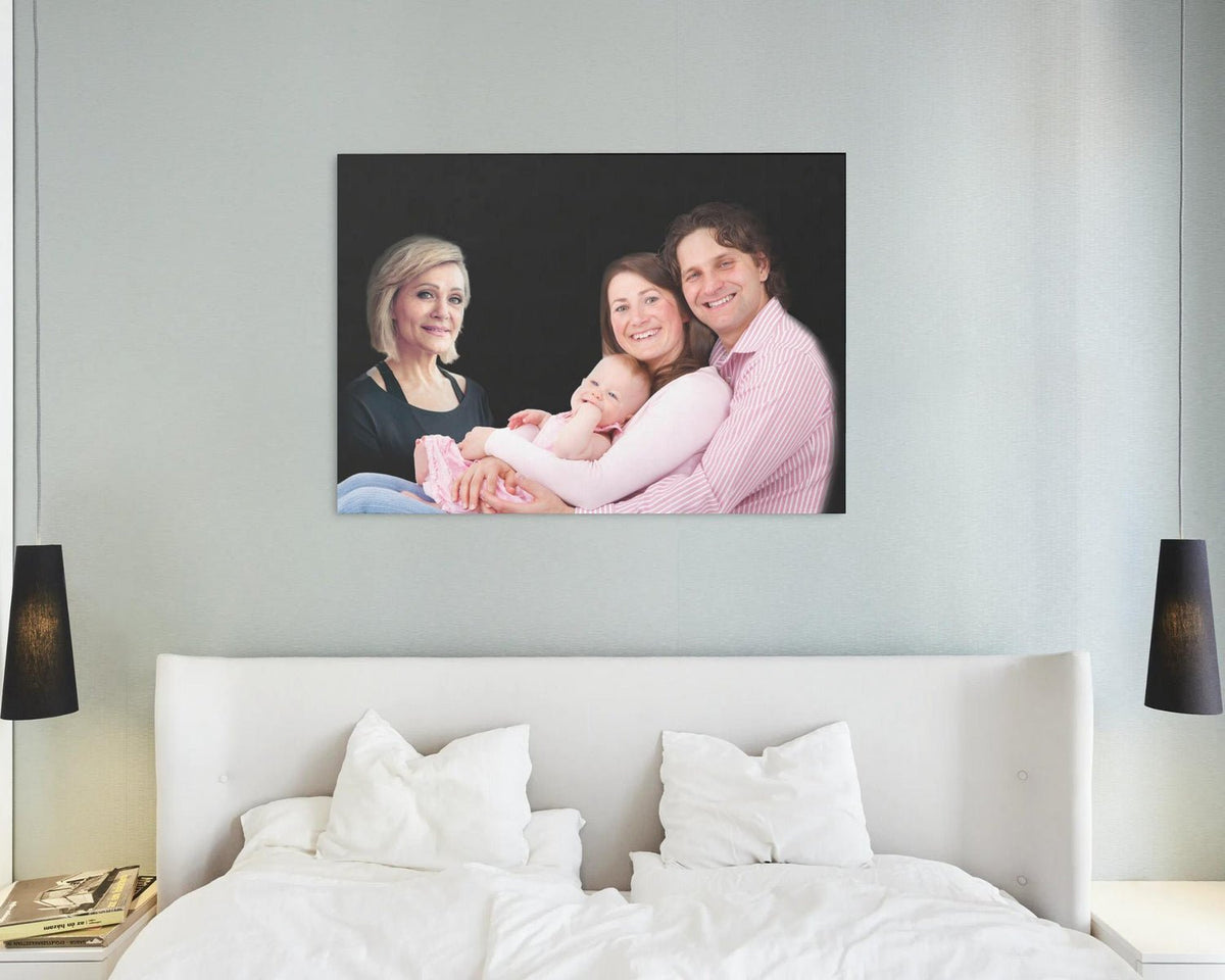 Thoughtful canvas print of deceased mother next to her family